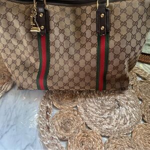 Vintage Gucci Bag with some wear and tear .
